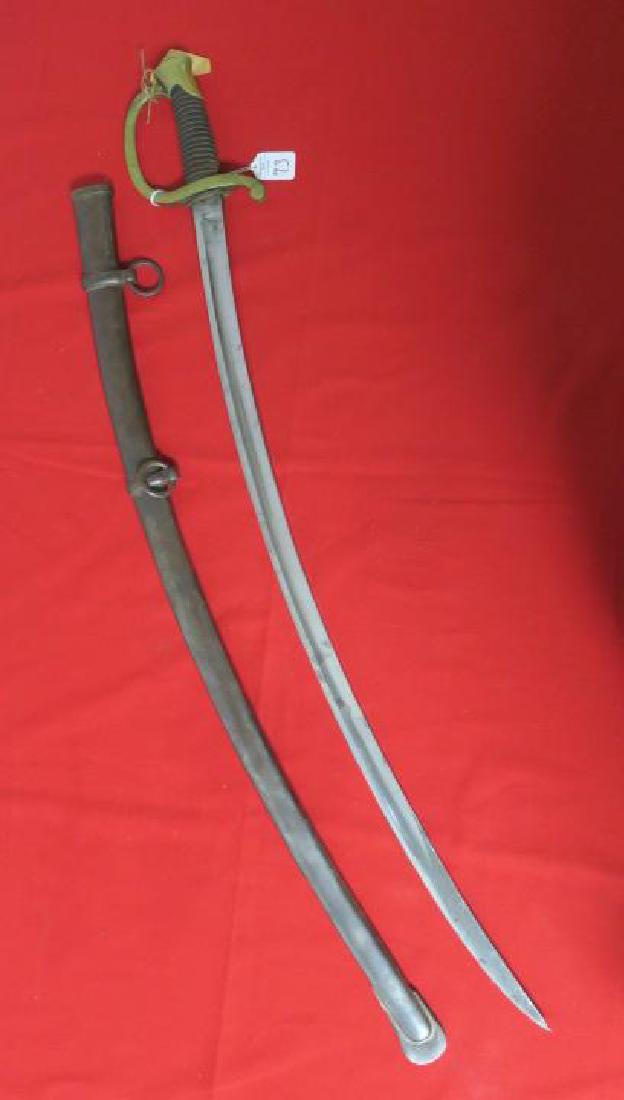 American LIGHT ARTILLERY SABER, MODEL 1840, DTG 1864:: American LIGHT ARTILLERY SABER, MODEL 1840, DTG 1864: Brass Phrygian Helmet Pommel, D shaped Knuckle-bow & Quillion. Wood Grips covered in Leather with Twisted Wire. 32" Blade Stamped "AMES N.P. Chico
