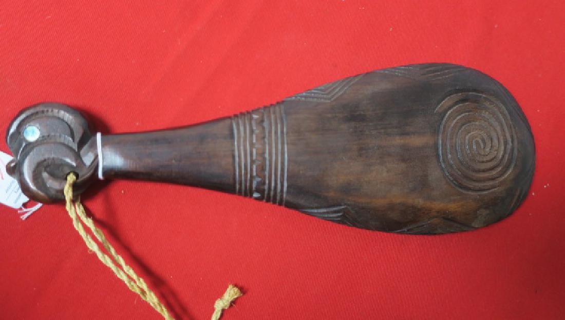 MORI PATU War Club, New Zealand:: MORI PATU War Club, New Zealand: Line Carved with Polynesian Sun Symbols and Line Decoration. Mother of Pearl Eye on Pommel, 15" x 5". (70-300)