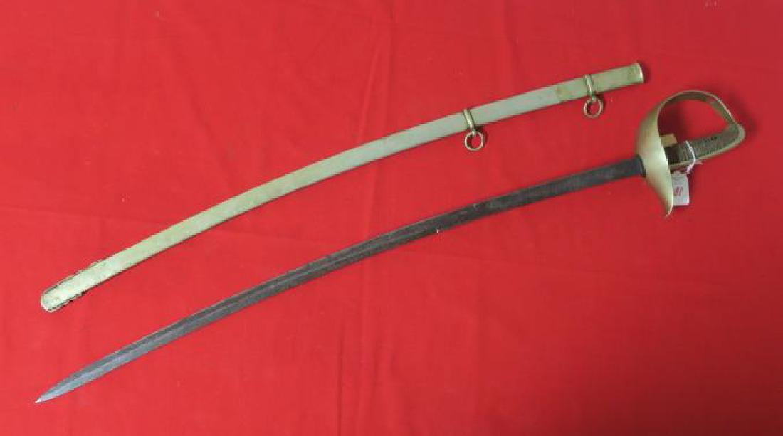 TOLEDO SPANISH LIGHT CAVALRY SABER CA 1889:: TOLEDO SPANISH LIGHT CAVALRY SABER CA 1889: 31" Curved Blade Marked "FABa DE TOLEDO 1889". Single Piece Shaped Knuckle-bow, Quillion, Birds Head Pommel and Backstrap. Wooden Grips with Wire Wrapping, 