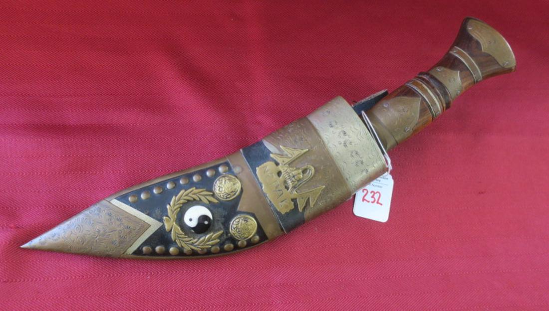 Heavily Decorated Presentation Style GURKHA KURHI:: Heavily Decorated Presentation Style GURKHA KURHI: Wood Handle with Brass and Carved Sun Decorations, Blade Etched with Birds and Mountain Scenes. Leather and Wood Scabbard with Brass Nepalese Symbols