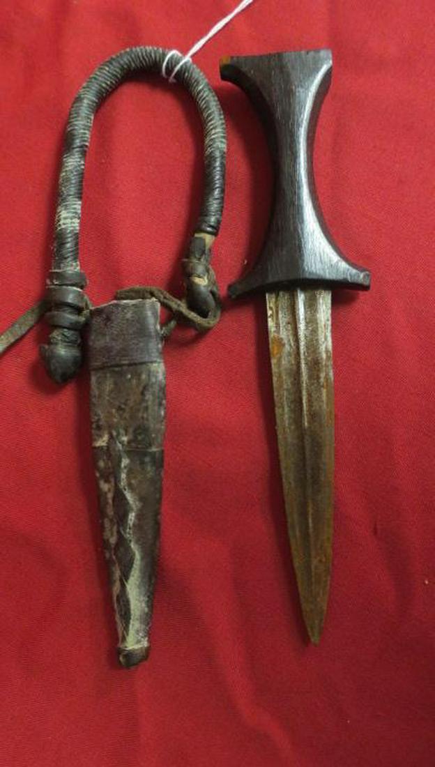 Antique Central African Arm Dagger w/ Wooden Handle:: Antique Central African Arm Dagger w/ Wooden Handle: Small Steel Dagger Generally Concealed on the Arms. Antique Leather Sheath with Wood Handle, Braded Leather Arm Band. 9" LOA, 5" Stiletto Engraved 