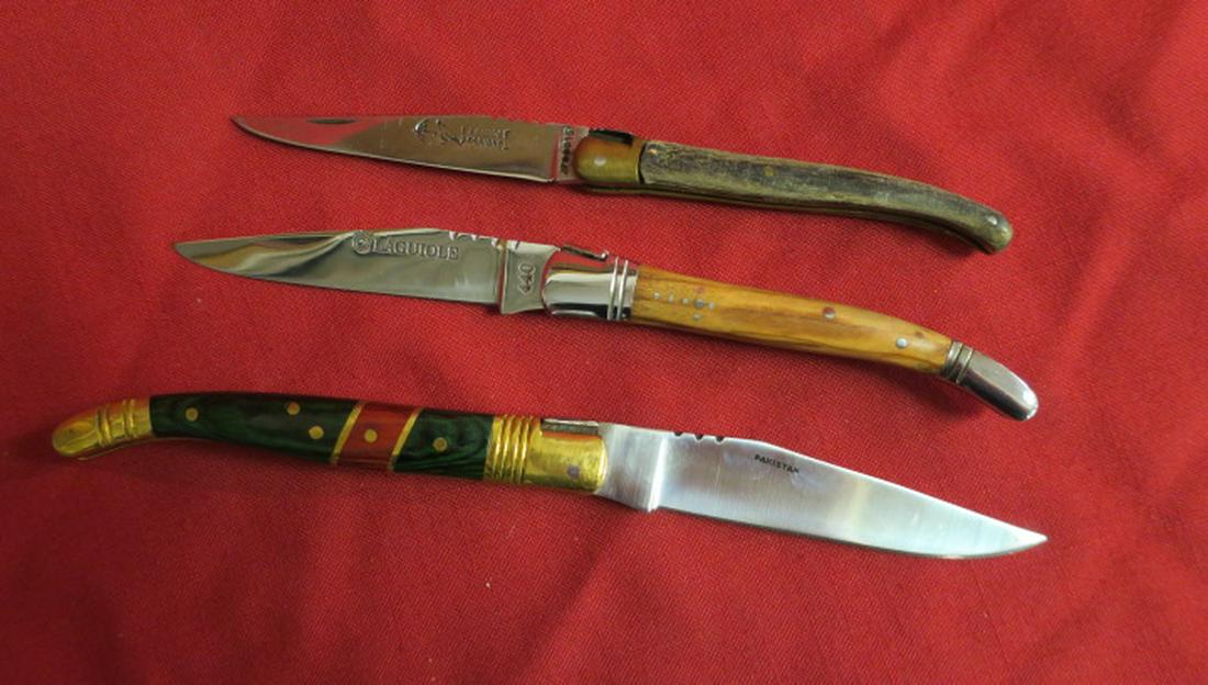 Three Folding Single Blade Pocket Knives:: Three Folding Single Blade Pocket Knives: Two French LAGUIOLE and a Brightly decorated Pakistani. (80-150)