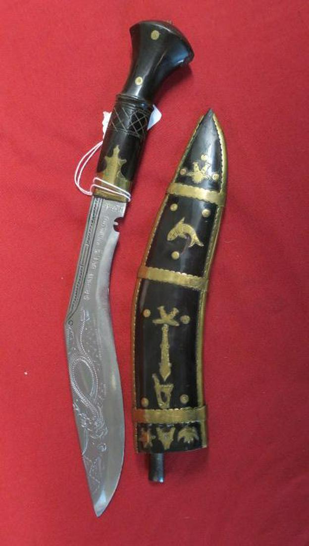 Presentation Gurkha Kurhi Knife:: Presentation Gurkha Kurhi Knife: Wooden Inlayed Grip, Engraved Blade. Black Ebonized Scabbard with Brass Inlay. 8" Blade, 14" Overall. Excellent Condition. (100-250)