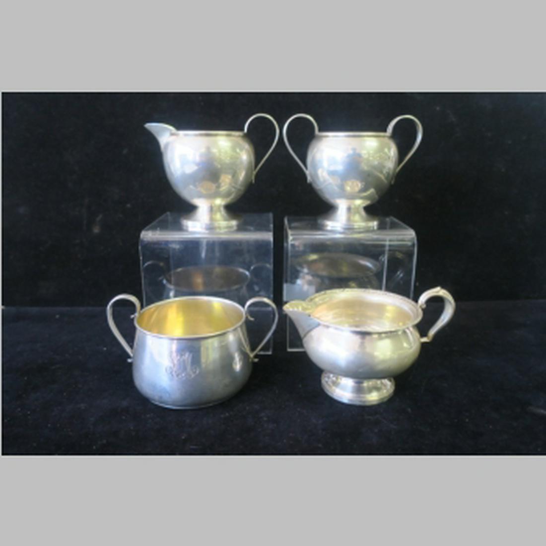 Four Sterling Silver Sugar Bowls and Creamers:: Four Sterling Silver Sugar Bowls and Creamers: Mueck-Carey Co 3 1/2"T Sugar and Creamer Set, Barbour Silver Co 2 5/8"T Flat Bottom Open Sugar and Fisher 3"T Creamer with Weighted Base. 9.6 oz. or 8.09