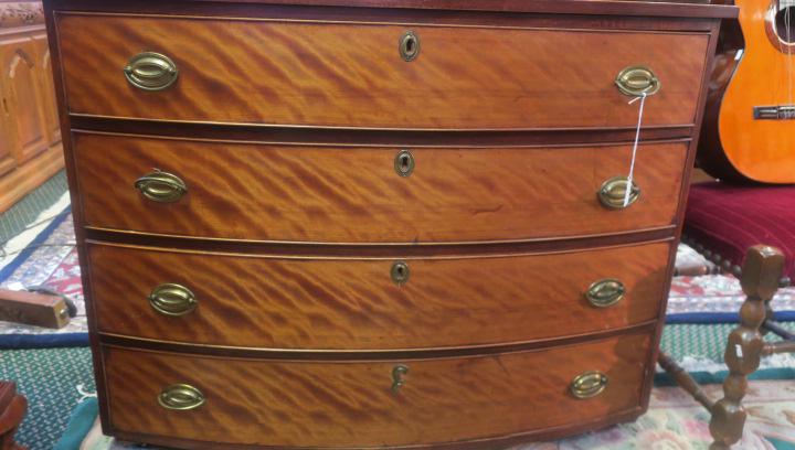 Flaming Birch 19th C. Bow Front 4 Drawer Chest:: Flaming Birch 19th C. Bow Front 4 Drawer Chest: Brass Bale Handles and Escutcheons on Chamfered Drawers. Pine Secondary Wood. 33"T, 43"W, 23"D. (400-600)