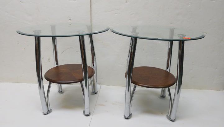 Coffee Table and Pair of Modern Glass End Tables:: Coffee Table and Pair of Modern Glass End Tables: Tempered Glass Top, 25 3/4" Round with Beveled Edge Set on Four Chrome Tubular Angled Legs. Lower Medial Round Teak Shelf Centered between Legs and Su