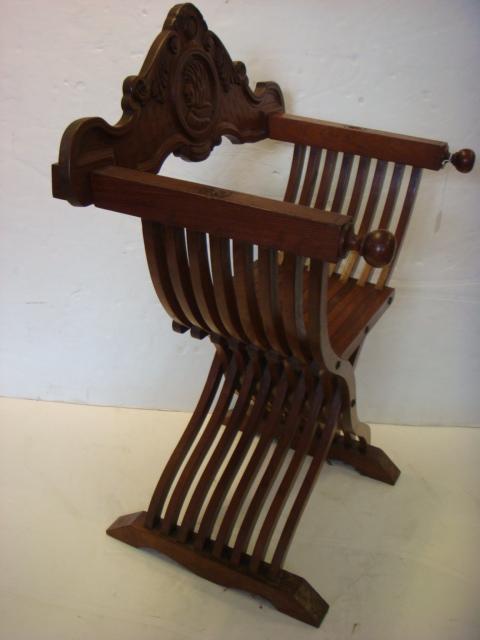 Vintage Savonarola Chair with Bas-Relief Monk Cameo:: Vintage Savonarola Chair with Bas-Relief Monk Cameo: Cross Ribbed Frame Arm Chair Named After Dominican Monk Girolamo Savonarda. Carved Cameo on Back. Cross Strut Legs in X Form. 37"T to Back. 21"W 21