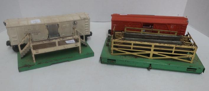 Two LIONEL AUTOMATIC Car and Dock Sets:: Two LIONEL AUTOMATIC Car and Dock Sets: 3472 Automatic Refrigerated Milk Car and Loading Dock. 3656 Automatic Livestock/Pig Car and Stockyard Dock. Good Condition, No Pigs, Milk Jugs or Controller Tra