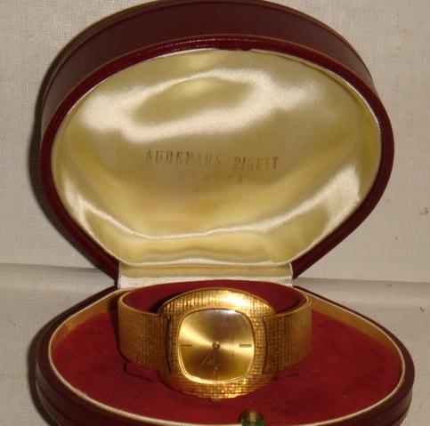 Gentleman's 18K Yellow Gold AUDEMARS PIGUET Watch:: Gentleman's 18K Yellow Gold AUDEMARS PIGUET Watch: 1970 Watch with Gold Face. Dedication on Reverse for Distinguished Service. Lays Flat when Open. AP on Clasp. Case Marked 42788. From Randall I. Berm