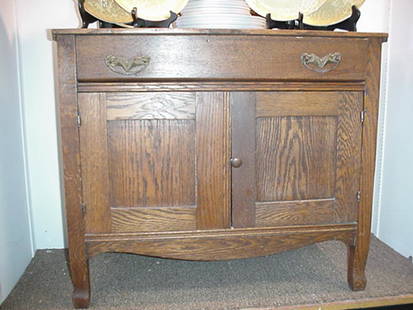Oak Single Drawer, Double Door Washstand: Oak Single Drawer, Double Door Washstand: 26 1/2"T X 17"D X 31"W, Dovetailed Single Drawer over Double Door Cabinet, Original Brass Hardware. Carved Apron and Curved Feet. (125-275)