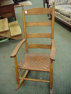 Oak Ladderback Rocker with Woven Seat: Oak Ladderback Rocker with Woven Seat: 31"D X 21"W X 41"T, 4 Rounded Slat Back, Top Slat Being Slightly Arched, Shaped Arms, Turned Spindles, Split Oak Woven Seat. (50-100)