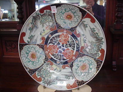 19th Century Imari Charger: 19th Century Imari Charger: Hand Painted Alternating Reserves of Tree Laden Mountains with Huts and Teal & Cinnabar Colored Medallions. Cobalt and Cinnabar Band with Orange Flowers. Cobalt and