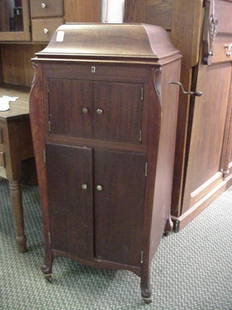 Mahogany Cased Floor Model Victrola: Mahogany Cased Floor Model Victrola: Victor Talking Machine, Complete with Needles, Crank and Accessory Boxes. Serial # 344727G. Shaped Exterior has 2 Front Cabinets Fitted with Record Shelves. 