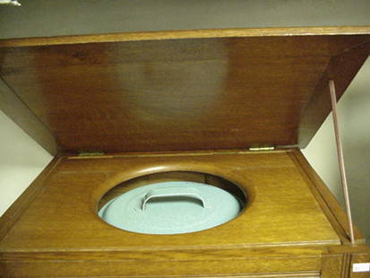 Oak Lift Top Potty Commode: Oak Lift Top Potty Commode: 16 1/2"D X 21 1/2"W X 19"T, Hinged Lid and Seat and Handy British Blue Enameled Spatterware Chamber Pot. Paneled Box Construction. (100-175)