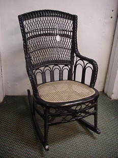 Black Wicker Lace Cane Seat Rocker: Black Wicker Lace Cane Seat Rocker: 21 1/2"W X 30"D X 34 1/2"T, Diamond Lattice Back with Arched Lower Section and Braided Sides with Curved Arms. X Stretcher with Ornamental Woven Apron. Natural
