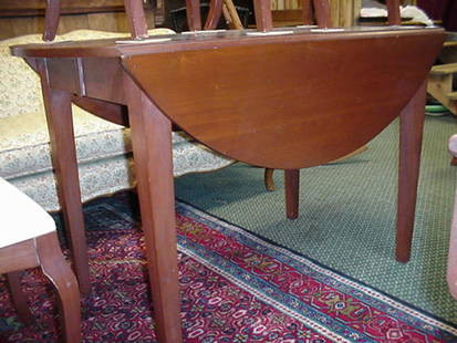 Cherry Drop Leaf Table with 4 Chairs: Cherry Drop Leaf Table with 4 Chairs: 48" Diameter, 30 1/2"T with Three 12" Leaves, Square Tapered Legs. Four 16"W X 17"D X 32"T Curved Ladder Back Chairs with Bracketed Crest Rail, Cabriole Legs &