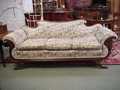 Mahogany Framed Cornucopia Carved Sofa: Mahogany Framed Cornucopia Carved Sofa: 33"D X 32"T X 86"L, Curved Back Continuous to Rolled Arms. Carved Scroll Arm Front, Fluted Apron and Splay Legs with Animal Paw Feet. Three Cushion Seat