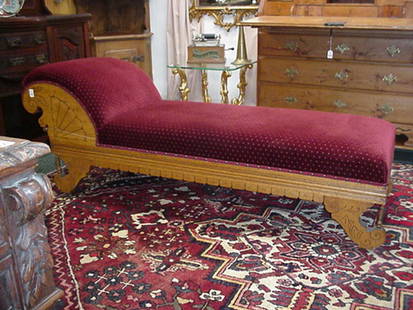 Oak Carved Velvet Upholstered Chaise Loun: Oak Carved Velvet Upholstered Chaise Lounge: Eastlake Styling with Line Carving, Fan and Leaf on Sides with Ring and Bead Turned Spindles Supporting Scrolled Legs on Castors. 3" Apron Meets Newly