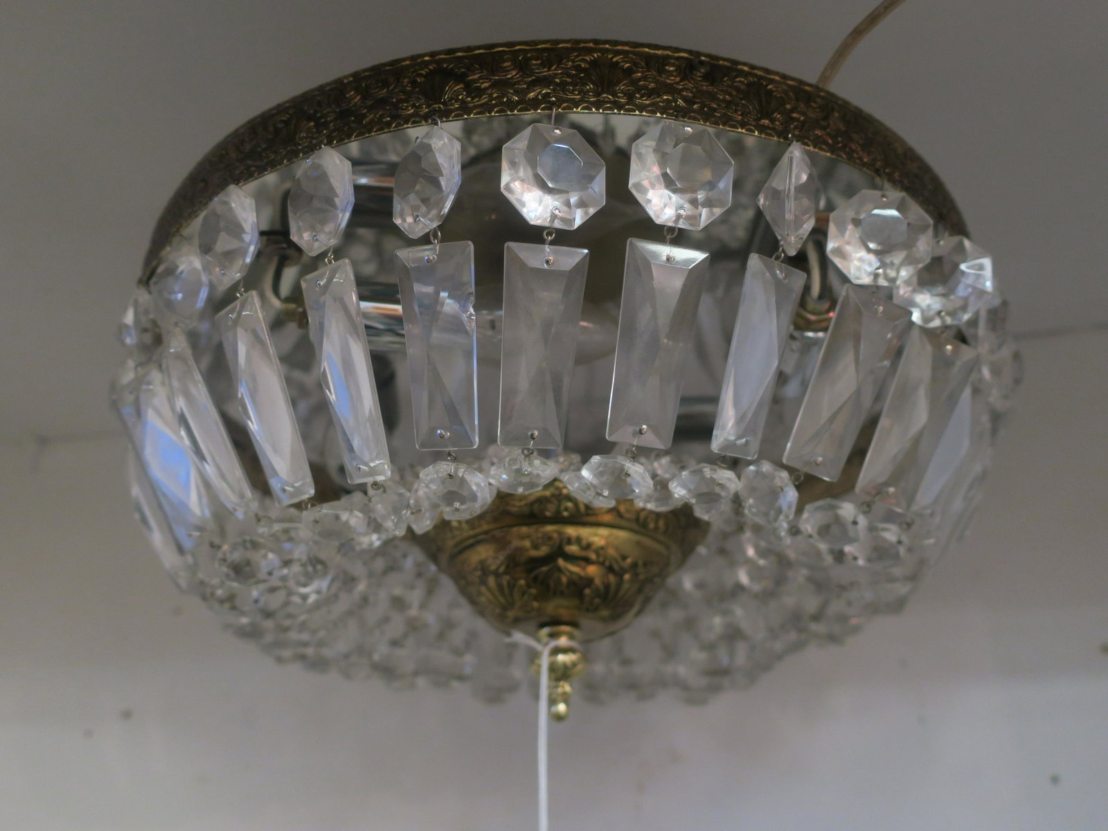 Crystal Basket Flush Mount Ceiling Fixture:: Crystal Basket Flush Mount Ceiling Fixture: Brass Embossed Top Frame Supports the Clear Baguette and Octagon Shaped Buttons That Swag to the Lower Brass Portion with Drop Finial. (100-200)