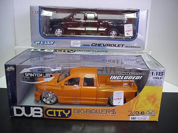 2 Diecast Metal 1/18 Scale Pick Up Trucks: 2 Diecast Metal 1/18 Scale Pick Up Trucks: Welly 1999 Chevrolet Silverado Pick Up and Dub City Big Ballers Dodge Ram Pick Up Trucks. Opening Hood & Doors, Detailed Engine & Interior. Mint in Box.