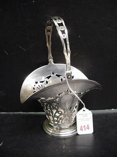 English Sterling Pierced Floral Basket with Handle: English Sterling Pierced Floral Basket with Handle: Marked Sterling with Lion Passant Facing Right, Date Letter G, 557A and Arrow. 7 1/2" Tall at Top of Hinged Handle. Sits on Three Step Style Round