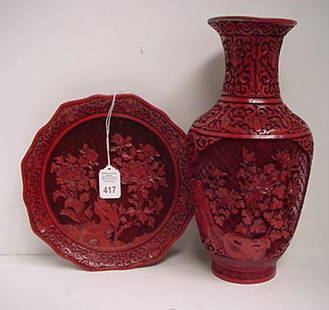 Carved Oriental Cinnabar Plate and Vase: Carved Oriental Cinnabar Plate and Vase: 9"D Plate with Floral and Scroll Lip and Raised Peony Branches Throughout Center. 12"T Vase is Lined in Brass and Pot Metal with Scroll Carved on Neck and