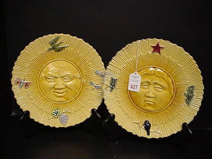 Early 20th C. Majolica Sun and Moon Plates: Early 20th C. Majolica Sun and Moon Plates: 9"D with High Gloss Yellow Glaze. Dimensional Faces in Center are Happy and Somber. Applied Symbolic Day & Night Figures Spaced Evenly Around Lip.