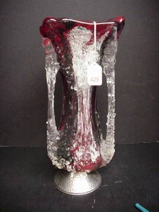 Red Art Glass Vase on Hammered Aluminum Foot: Red Art Glass Vase on Hammered Aluminum Foot: 15"T with 3 Evenly Spaced Icicle Handles Spanning Length of Vase. Done in Style that Gives Appearance of Clear Candle Wax Dripped on Variegated Red Glass.