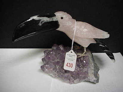 Rose Quartz Toucan on Amethyst Crystal: Rose Quartz Toucan on Amethyst Crystal: Black Carved Stone with White Striations Form Beak and Tail. Bird is 9 1/2"L.