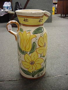 Large Hand Painted Pottery Jug: Large Hand Painted Pottery Jug: Italian Handled Pitcher Shape with Yellow Flowers and Green leaves on Cream Ground. Minor Chipping on Top Edge. 20"T with 9"D Opening.