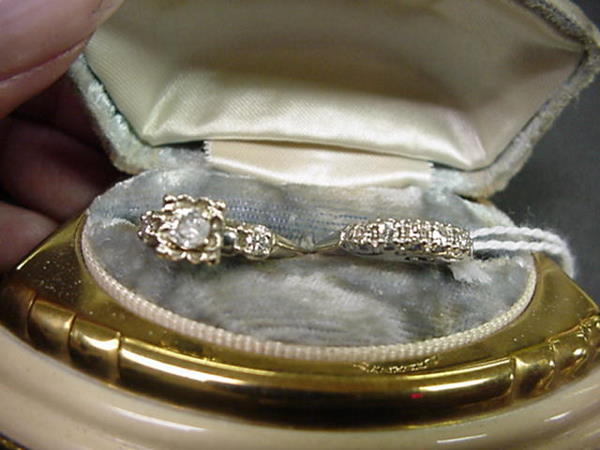 Ladies Vintage Diamond Engagement and Wedding Rin: Ladies Vintage Diamond Engagement and Wedding Ring: Set in 14KT White Gold. Engagement Ring Has 1/4CT. Center Stone Flanked by 5 Point Diamonds on Side. Band Has 4 Diamonds Set on Crown DTW 1/4CT.