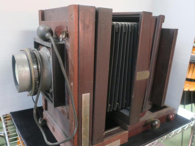 EASTMAN KODAK Sliding Carriage Portrait Camera:: EASTMAN KODAK Sliding Carriage Portrait Camera: Mahogany Frame with Cast Metal Carriage Inscribed "For 7a or 9a Camera" Made by Folmer & Schwing. Adjustable Leather Bellows, Bausch & Lomb Portrait Len
