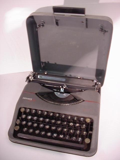 HERMES Portable Typewriter: 87. HERMES Portable Typewriter Serial Number 349625, Sleek, Small Design, Metal Carrying Case. Very Good Condition.