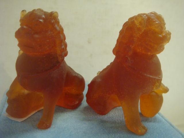 Pair of DAUM France Pate De Verre Foo Dogs:: Pair of DAUM France Pate De Verre Foo Dogs: Amber Glass Foo Dog Figures, Male with Ball and Female with Pup are 2 1/8"T. Signed on Bottoms. Mid 20th Century. (150-300)