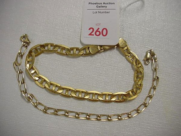 Ladies and Gents 14KT Link Bracelets: 260. Ladies and Gents 14KT Link Bracelets: .54ozt. Gents Anchor Link Bracelet has Lobster Clasp, 8 1/4"L. Ladies .12ozt. Fitted Wide Link Measures 7 3/4"L with Lobster Clasp.