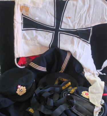 US, Russian and German Navy Uniform Parts:: US, Russian and German Navy Uniform Parts: US Navy "CRACKER JACK" Blouse and Cap, Russian Submariners Beret and Russian Watch Officers Cap, German Minesweeper Pendant "SCHULTZ" and Hat Trim MINESWEEPE
