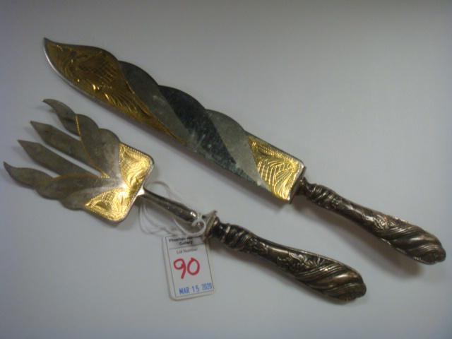 Antique 800 Silver with Gold Wash Fish Knife, Fork:: Antique 800 Silver with Gold Wash Fish Knife, Fork: Serving Knife is 11 3/4"L and Fork is 9 1/4"L. Hollow Handles with Scrolls and Foliate are Marked 800. Etched Blades with Gold Wash. (100-200)
