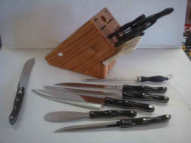 18 Piece Set of CUTCO KNIVES in Wooden Block:: 18 Piece Set of CUTCO KNIVES in Wooden Block: Made in USA. Set Includes Eight Assorted Knives, Two Serving Forks and 8 Steak Knives-6 with White Handles. Includes Non-Cutco Sharpening Tool. All in Cut