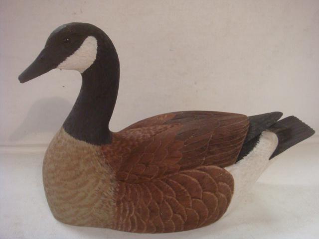 HAROLD WINGER, Wooden Carved CANADA GOOSE, 1984:: HAROLD WINGER, Wooden Carved CANADA GOOSE, 1984: Fine Feather Detail, Glass Eyes, 801/2" x 12". signed and Dated on Bottom. Minor Damage to Bill. (150-300)