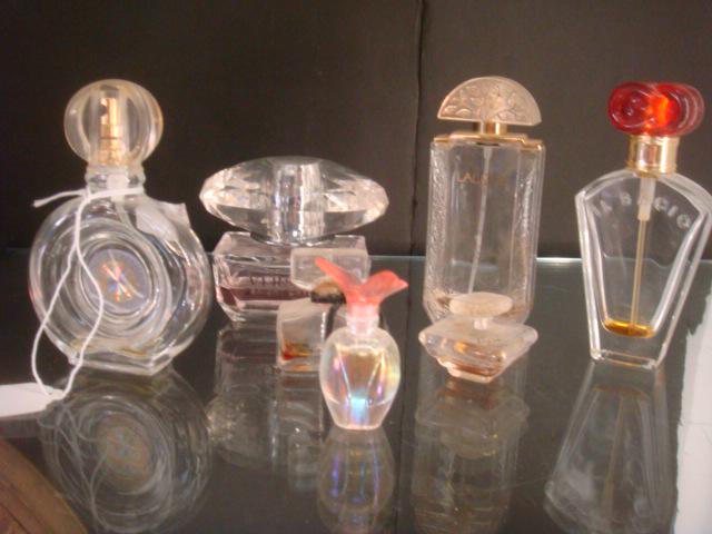 Seven Assorted Famous Maker Perfume Bottles:: Seven Assorted Famous Maker Perfume Bottles: Includes Lalique, Versace Bright Crystal, Lancome Tresor, Guy Laroche Fidgi, Il Bacio, Rochas Byzantine, OJA? Small Bottle with Butterfly Stopper. Most hav