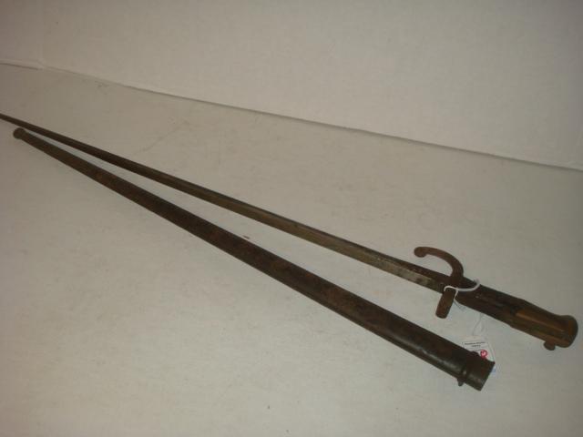 French Bayonet with Metal Scabbard; CA 1881:: French Bayonet with Metal Scabbard; CA 1881: Bayonet with Sword Breaker Hilt. Fair Condition. Rusted Handle and Hilt. (50-100)