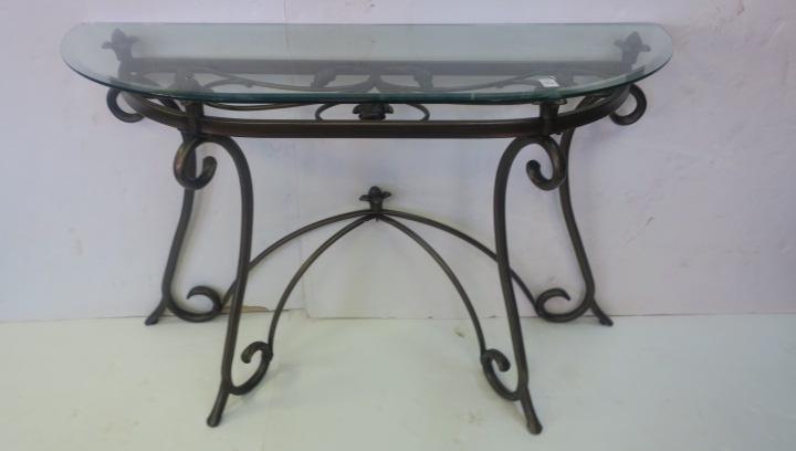 Glass Topped Demilune Console Table on Metal Base:: Glass Topped Demilune Console Table on Metal Base: Curved Arms on the Demilune Frame Support the 4'2" X 18"D Beveled Glass Top. Tubular Legs Fan Out and Are Connected and Braced by a Canopy Form with 