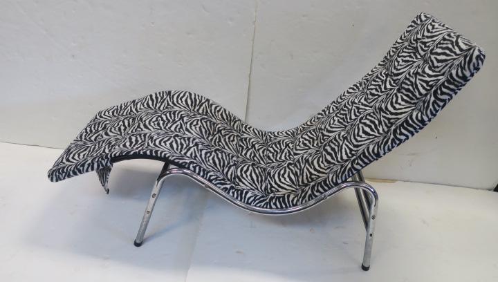 Zebra Fabric Covered Tubular Chaise Lounge:: Zebra Fabric Covered Tubular Chaise Lounge: Soft Plush Black & White Striped Horizontal Stitched Sections, 5"X 21". Chaise Measures 56" Long, 33 1/2" to Back. Chrome Tube Base with Double Tube at Back