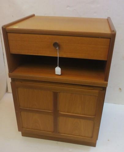 NATHAN FURNITURE Mid-Century Teak Cabinet/End Table:: NATHAN FURNITURE Mid-Century Teak Cabinet/End Table: For Nathan Furniture With Single Drawer with Single Wood Pull; Matches Lots 201 & 203. Over Open Shelf Above Cross Decorated Single Door Storage Ar