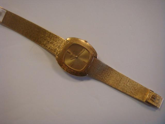 Female/Male AUDEMARS PIGUET 18K Yellow Gold Wristwatch: Female/Male AUDEMARS PIGUET 18K Yellow Gold Wristwatch 1970 Watch with Gold Face. Dedication on Reverse for Distinguished Service. Lays Flat when Open. AP on Clasp. Case Marked 42788. From Randall I. 