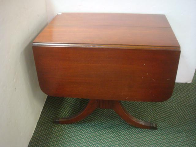 Vintage Mahogany Drop Leaf Duncan Phyfe Style Table:: Vintage Mahogany Drop Leaf Duncan Phyfe Style Table: Double Harp Shaped Pedestal with Flared Legs Ending in Metal Caps. 15 1/2" Drop Leaves Supported by Metal and Spring Hardware. Lexington Chair Co.,