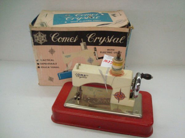 COMET CRYSTAL Child's Sewing Machine, Box: 1037. COMET CRYSTAL Child's Sewing Machine, Box: With Electric Light. "Sews Like Mother's". Age Appropriate Wear. Battery Operated.