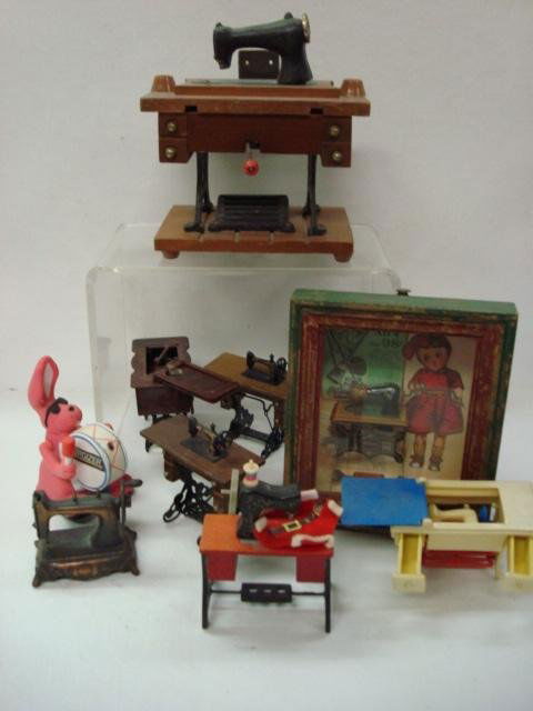 Sewing Machine Motif Doll Furniture, Magnets, Sal: 1075. Sewing Machine Motif Doll Furniture, Magnets, Salt and Pepper Pictures, Pencil Sharpeners, Working Music Box and Charms. The Classic Antique Singer Motif. Many with Moving Parts.