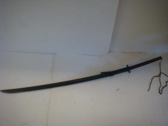 Japanese ODACHI or Great Sword, Post War:: Japanese ODACHI or Great Sword, Post War: Worn on the Back or Carried, this Longer Sword was Outlawed by the Shogun Government in 1617. This One has a Sword Catcher/Breaker Tsuba. Red Sami 16" Handle