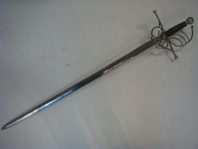 Musketeers Rapier with Basket Guard, Replica:: Musketeers Rapier with Basket Guard, Replica: Leather Grip with Wire Wrapping. Cross Style Hilt with Sword Catchers. 36" Blade and 8" Handle Ends in Skull Cracker Pommel. Porthos Favorite, Agile but R